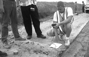 Photo of maturity meter devices being read before ground is covered by concrete