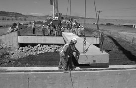 Workers installing deck units