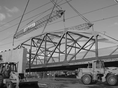 Bridge lifted by cranes