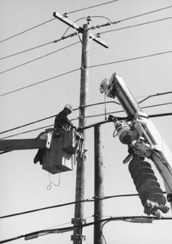 Close up photo of utility engineer working on powerline