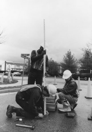 Utility engineer at a test hole