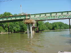 The replacement and widening of a 45-year-old steel-girder bridge on State Route 22 in Pickaway County, Ohio, was accomplished in 50 days. The bridge had to be erected by working from a trestle for 96 m (315 ft) of the 109-m (360-ft) bridge span.