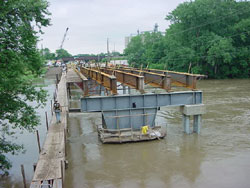 The replacement and widening of a 45-year-old steel-girder bridge on State Route 22 in Pickaway County, Ohio, was accomplished in 50 days. The bridge had to be erected by working from a trestle for 96 m (315 ft) of the 109-m (360-ft) bridge span.