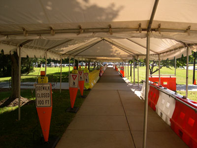 The demonstration of pedestrian accommodation and delineation devices was held in a simulated work zone walkway at FHWA's Turner-Fairbank Highway Research Center in Mclean, VA.