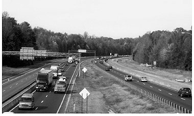 Photo. An aerial view of Interstate 77. Moderate traffic is flowing in both directions.