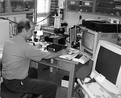 Photo: A close-up view of D. Stephen Lane, senior research scientist, in the Virginia Transportation Research Council's (VTRC) Petrography Laboratory, Charlottesville, VA.