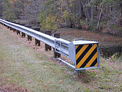 A close-up shot of a roadside guardrail.