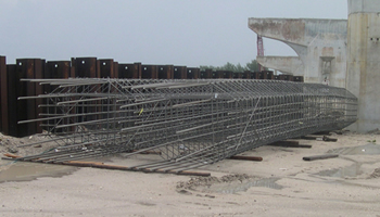 Figure 9. Photo. Solid stainless steel reinforcing bars at a bridge construction site.