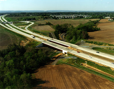Figure 9. Photo. An aerial view of a highway with vehicles traveling on it.