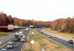 Figure 9. Photo. A view of a four-lane highway. Traffic is traveling in both directions on the highway.