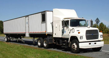 Figure 6. Photo. A view of the rolling wheel deflectometer (RWD). The RWD collects continuous deflection profiles at normal highway speeds, without the need for lane closures.