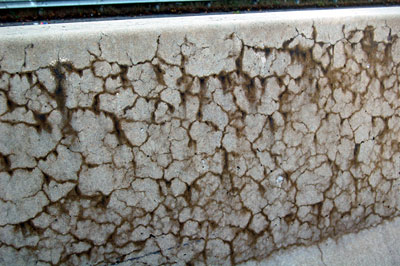 Figure 1. Photo. A close-up of a concrete structure exhibiting cracking as a result of alkali-silica reactivity.