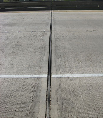 Figure 2. Photo. A close-up shot of a new bridge deck joint on a bridge in Louisiana.