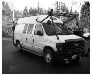 Figure 3. Photo. A specially designed van used by the Washington State Department of Transportation to perform bridge deck inspections. The van has three video cameras mounted on top of the front of the vehicle.