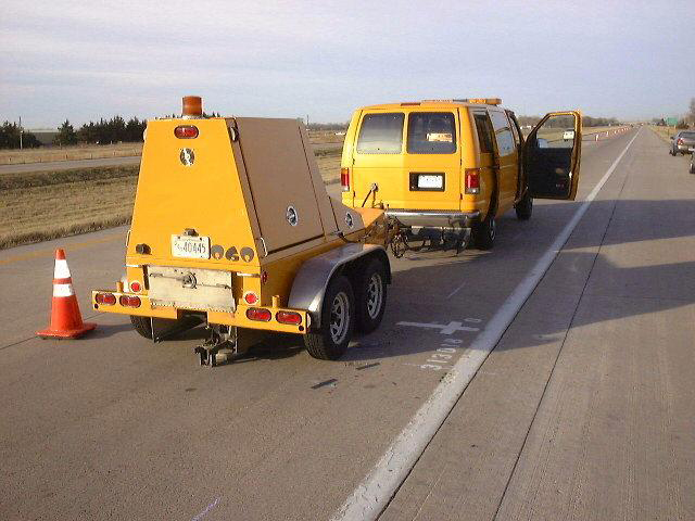 An LTPP Falling Weight Deflectometer (FWD) is used to test pavement on a roadway.