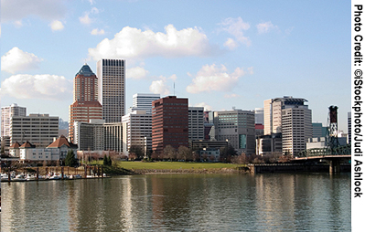 A view of downtown Portland, Oregon, with the Willamette River in the foreground.
