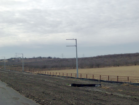 Utility poles along State Highway 130 in Texas.