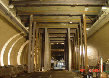 The interior of Hanging Lake Tunnel on I-70, near Glenwood Springs, CO. Scaffolding is visible in the tunnel and repairs are being made to the ceiling.