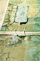 photo of severe cracking on concrete structure.