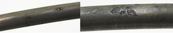 This image shows physical condition of the corroding wires removed from a 0.8-percent chloride concentration single strand specimen. Pitting damage can be seen in the left and right photos.