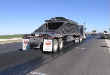 Figure 4. Photograph of a Belly-Dump Haul Truck used at the Texas SPS-10 test site.