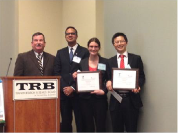 Figure 5. Group photo of Holly Faubert, on behalf of the student team, and Changwei Xu receiving the 2014 Data Analysis Contest Award. The award presentation was made by T&DI President Brian McKeehan and T&DI Director Muhammad Amer.