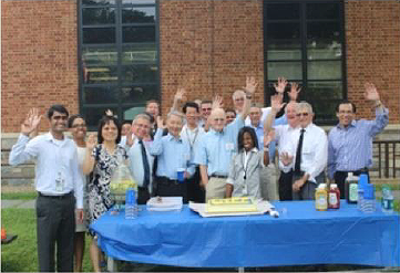 Figure 7. Group photo of the LTPP Team members gathered with guests on the grounds of Turner-Fairbank Highway Research Center.