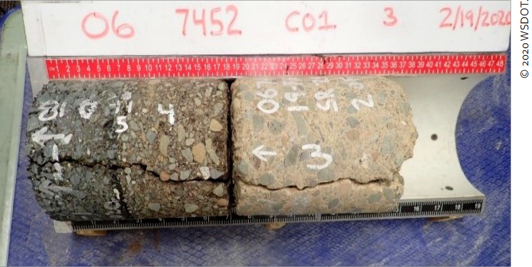 This figure shows a photograph of a core taken at California LTPP test section 067452 on February 19, 2020. The core has been positioned horizontally such that the top of the core is to the left in the photograph and the bottom of the core is to the right. A crack is shown across the sample and numbers and two left-pointing arrows are written on the sample. © 2021 WSDOT.