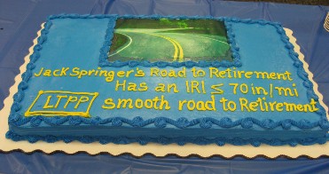 Photograph of a congratulatory cake for Jack Springers retirement.