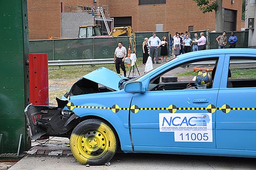 A car crashes into a barrier at the Federal Outdoor Impact Laboratory (FOIL) at Turner-Fairbank Highway Research Center.