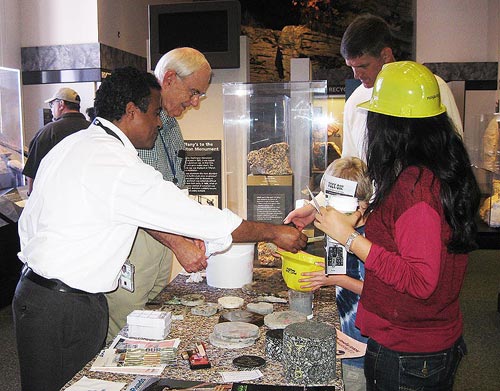 On September 29, Richard Meininger (rear), a civil engineer and member of FHWA's pavement materials research team, and Mengesha Beyene (front), a geologist and contractor at TFHRC, volunteered their time at an educational event on rocks and geology at the National Museum of Natural History.
