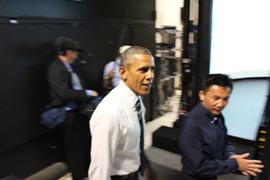David Yang, Human Factors Team Leader, shows President Barack Obama FHWAâ€™s Highway Driving Simulator during his tour of the Turner-Fairbank Highway Research Center. The President quipped that it was the first time that he had driven a car, relatively speaking, in 6 years.
