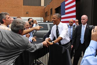 AAs the President made his exit, he took a few moments to shake the hands of FHWA employees. In the background, the security detail watched closely.