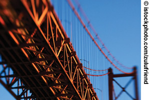 Photo. Partial view of a suspension bridge.