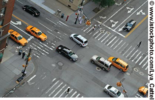 Photo. A birds-eye view of traffic at an intersection.