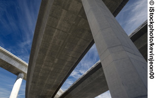 A photo shows a close up of a bridge support.