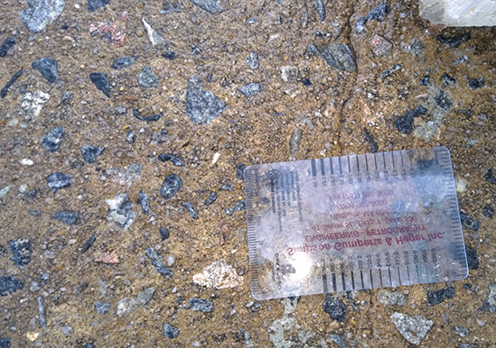 Close-up photo of a chemically-activated binder concrete slab removed from Interstate 16 in Dublin, Gerogia. There are only a few cracks visible in the slab, most likely as a result of the process of removing the slab the roadway.