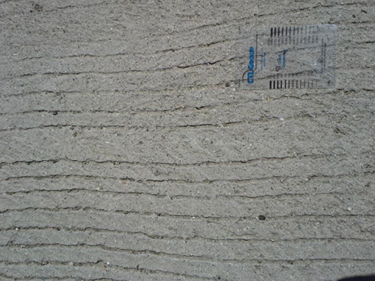Close-up photo of the road surface of Route 60W/71S interchange in Los Angeles, which is in good condition. 