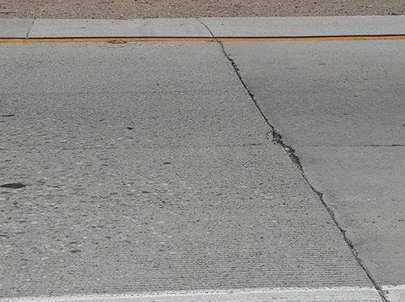 Photo of Route 60W/71S interchange in Los Angeles. In this photo the roadway shows surface wear and minor joint spalling. 