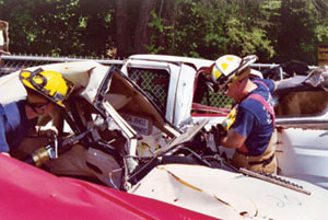 Fairfax County firefighters practice extraction techniques using TFHRC crash test vehicles. 