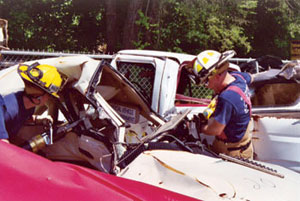 Fairfax County firefighters practice extraction techniques using TFHRC crash test vehicles.