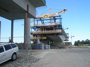 Stock photo shows an overpass bridge that is under construction.