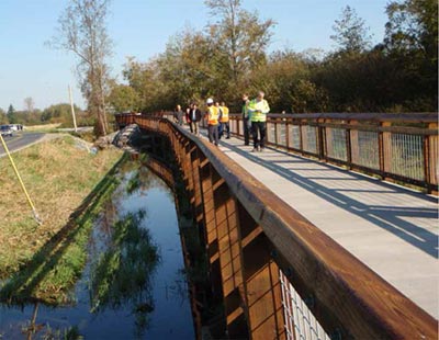 This figure shows how FHWA created an environmentally sensitive, multiuse path beside the Haxton Way in Washington that eliminated fatalities on roadway shared by pedestrians, bicyclists, and motorists. (Image source: FHWA)