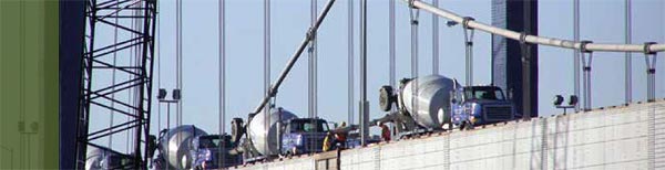 This figure shows how cement trucks deliver concrete for the deck of the existing Paseo Bridge in Missouri as part of a project that used innovative design techniques to accelerate bridge construction. (Image: FHWA)