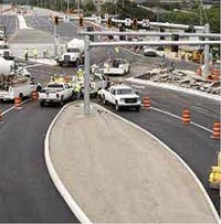 This figure illustrates workers finishing construction on a new diverging diamond interchange. (Image source: FHWA)