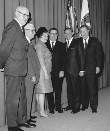 Francis C. “Frank” Turner was sworn into office as Federal Highway Administrator on March 19, 1969. Attending the ceremony were (left to right) Representatives George H. Fallon and John C. Kluczynski of the House Public Works Committee, Mrs. Mabel Turner, Administrator Turner, Secretary of Transportation John A. Volpe, who administered the oath of office, and Senator Jennings Randolph of the Senate Public Works Committee.