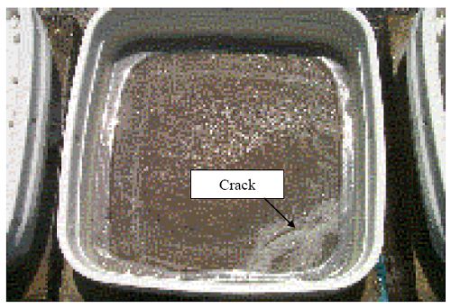Example showing corner cracking on a 2201 reinforced simulated deck slab specimen.