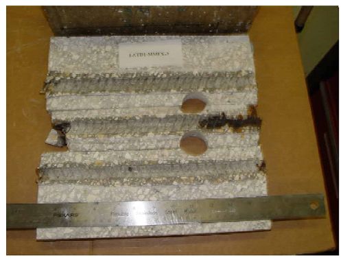 The photo shows heavy corrosion products at the ends of one of the three bars.