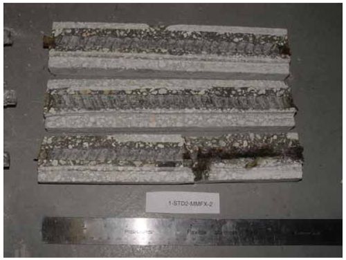 Heavy corrosion products are apparent along about one-half the length of one bar with small amounts at the ends of the other two bars.