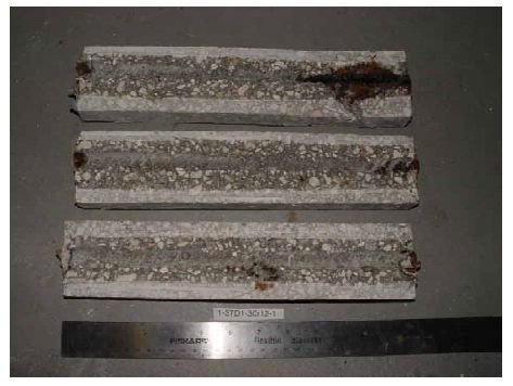 The photo shows corrosion products at the bar ends that are particularly heavy in one instance.